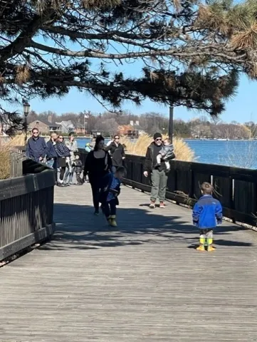 Families taking a stroll through Patterson Park