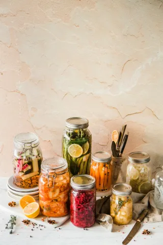 jars containing colorful food.