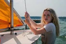 girl sailing a sunfish sailboat
